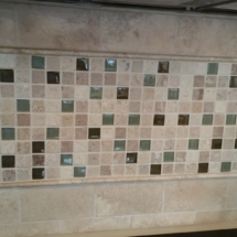 Travertine and glass back splash