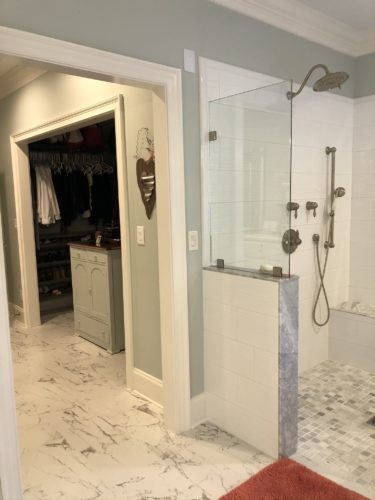 unified flooring in master bath and closet