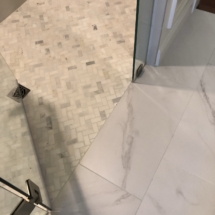 Schluter zero-entry shower with marble floor