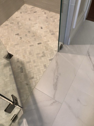 Schluter zero-entry shower with marble floor