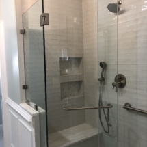 white shower with marble-topped bench