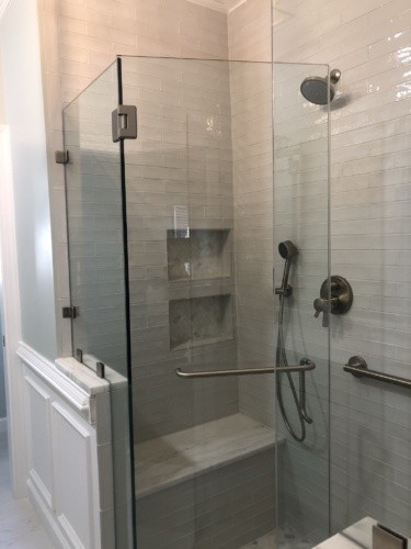 white shower with marble-topped bench