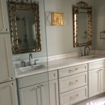 SW Sea Salt cabinets with gold bamboo-look mirrors