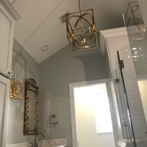 gold sphere chandelier in bath