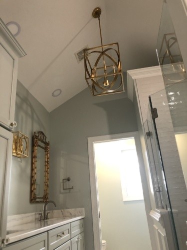 gold sphere chandelier in bath