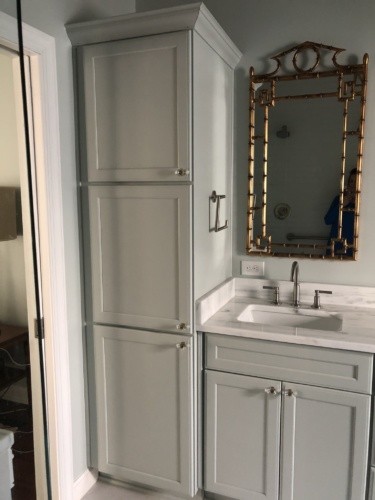 tall linen cabinet and gold mirror