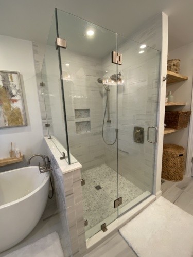 White shower with marble floor and accents