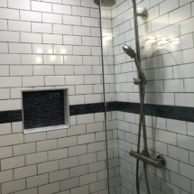 White subway tile charcoal grout shower