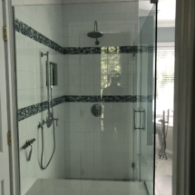 Hand-made blue mosaic tile is a lovely accent to the classic white subway tile