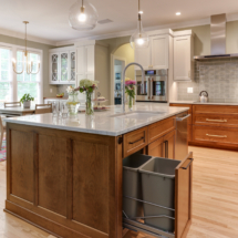 Island with p/o trash, sink, dw and glass pendants